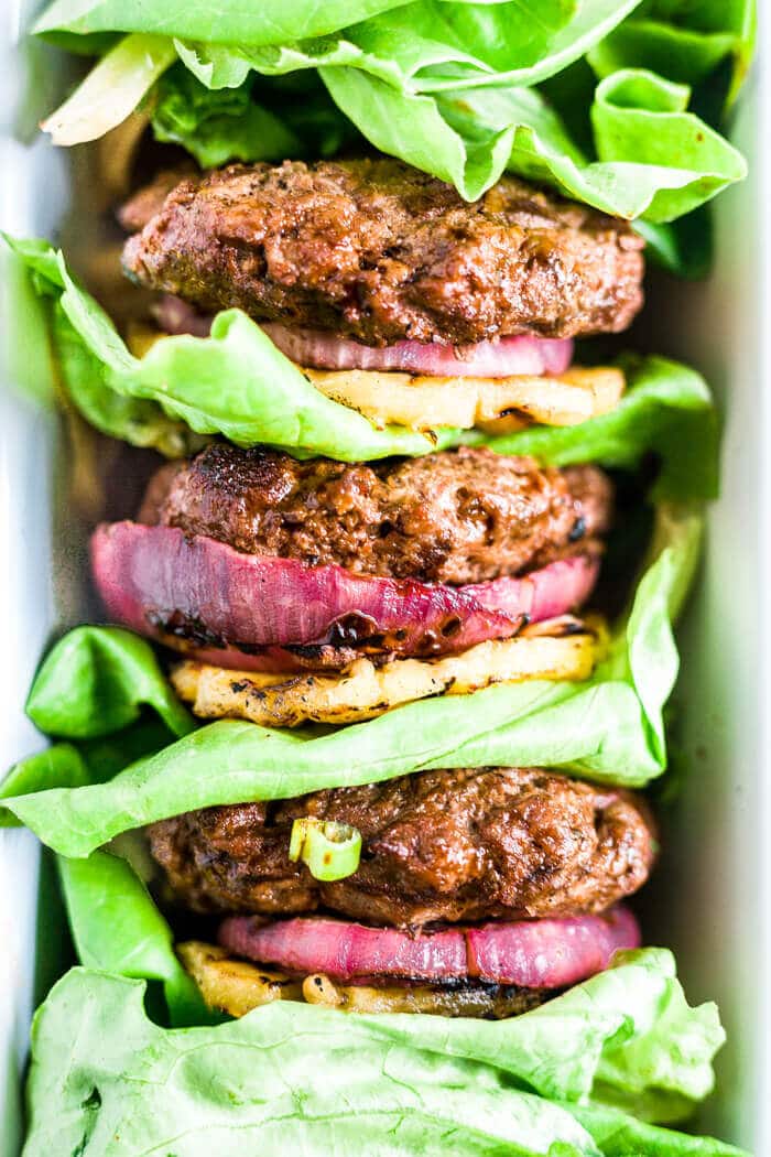 three hawaiian teriyaki burgers stacked with lettuce