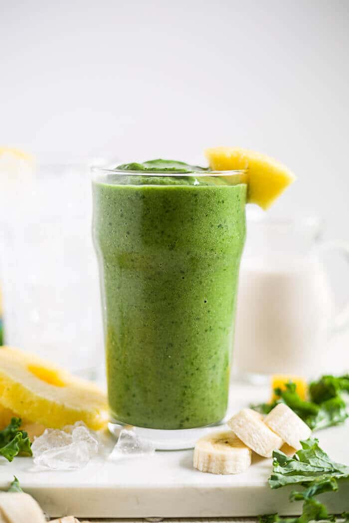 Tropical Kale Smoothie 1 kale smoothie in a tall glass with pineapple