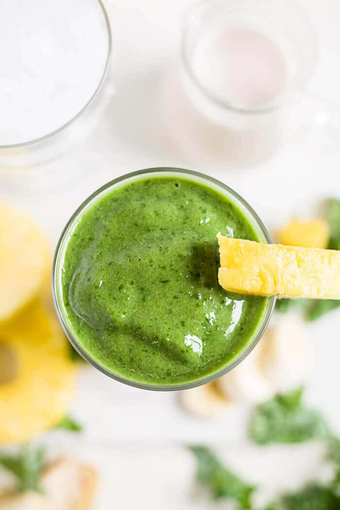 Tropical Kale Smoothie 4 top of the glass of a dark green kale smoothie