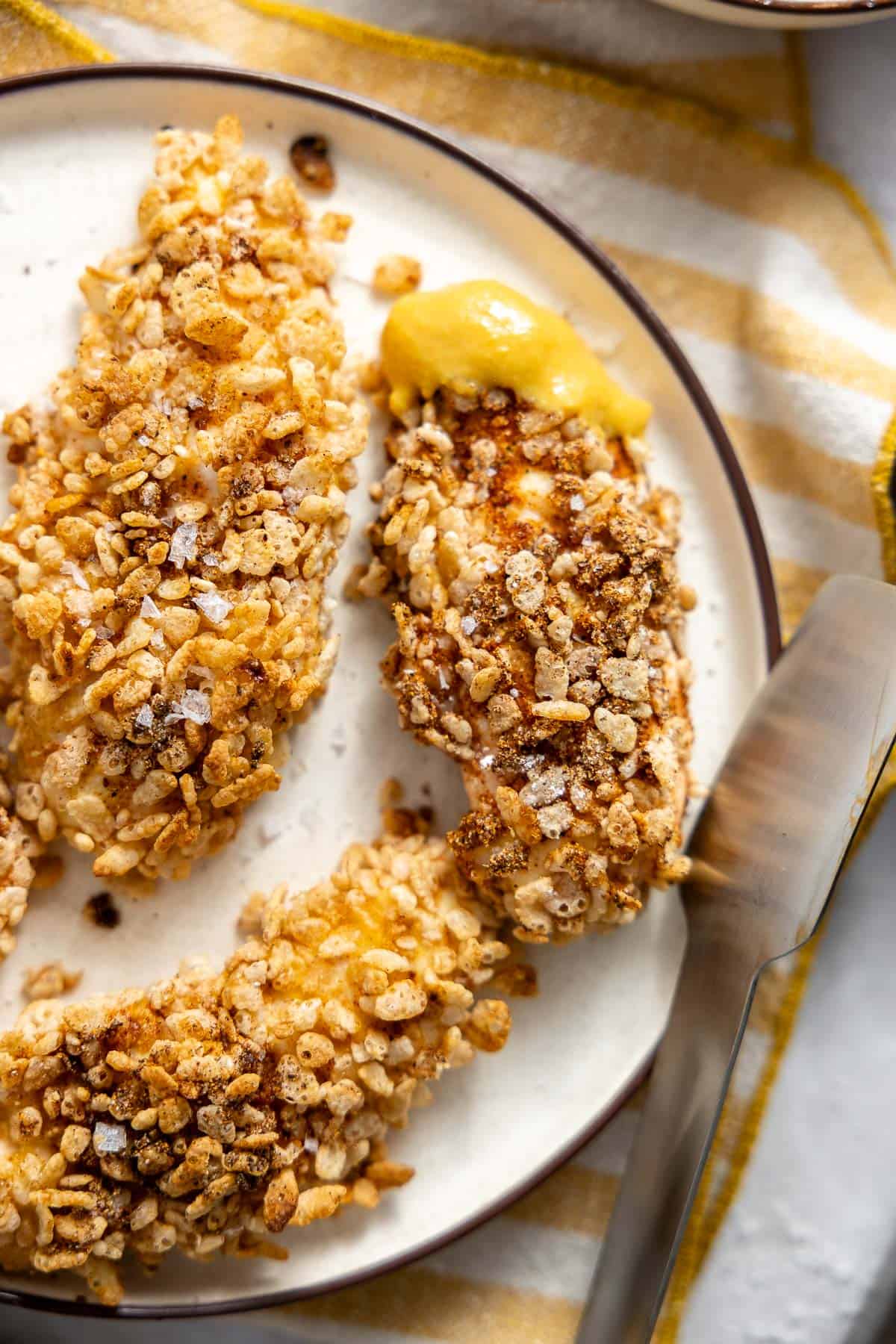 rice krispie chicken tenders on a plate.