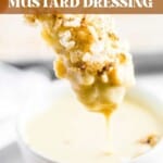 rice krispy chicken tender dipping into a bowl of healthy honey mustard