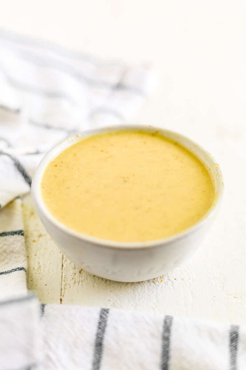 honey mustard dressing in a white bowl