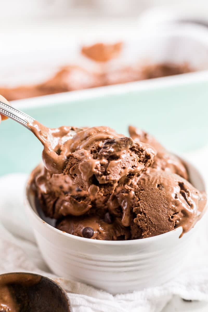 a big bowl of banana and chocolate ice cream with some melting down the side