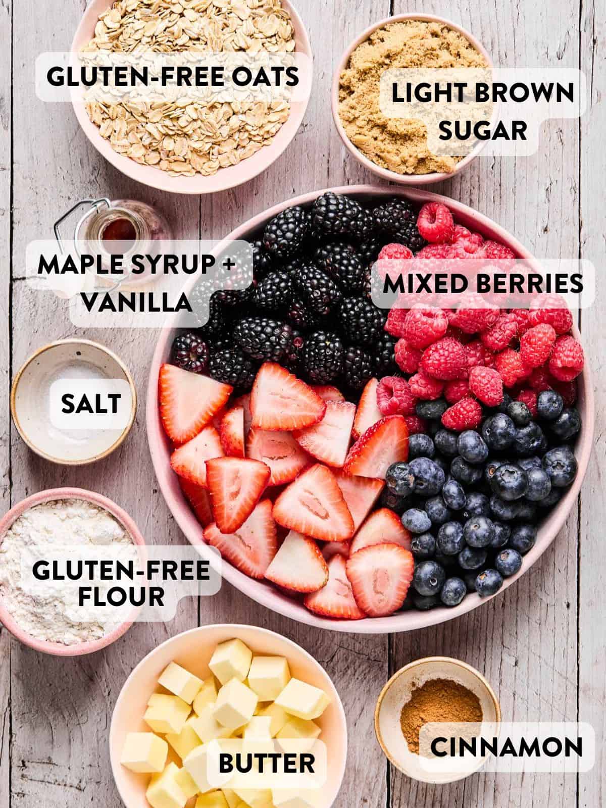 ingredients for gluten free berry crisp separated out in bowls on a counter