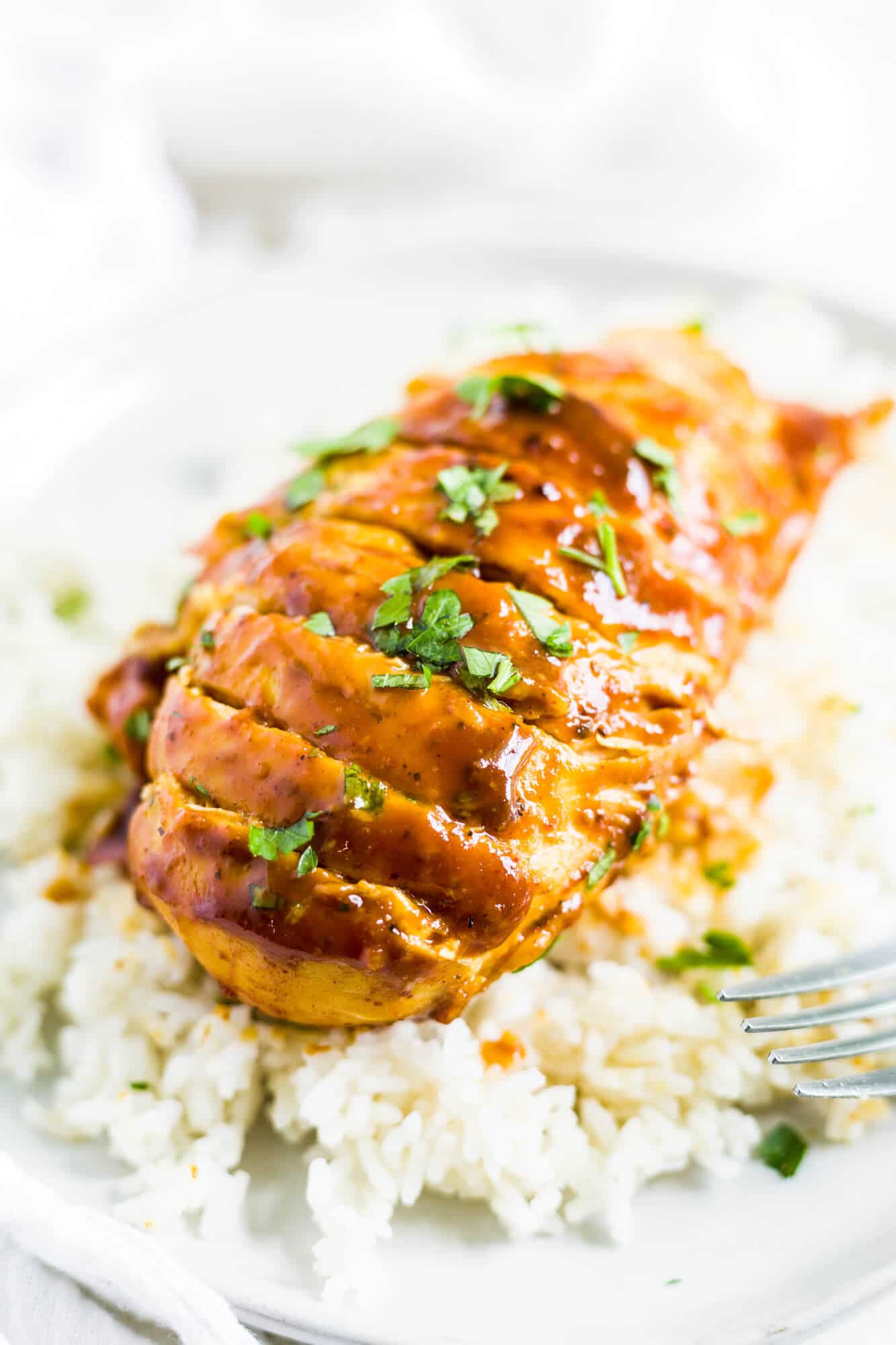 instant pot honey mustard chicken on a plate with rice.