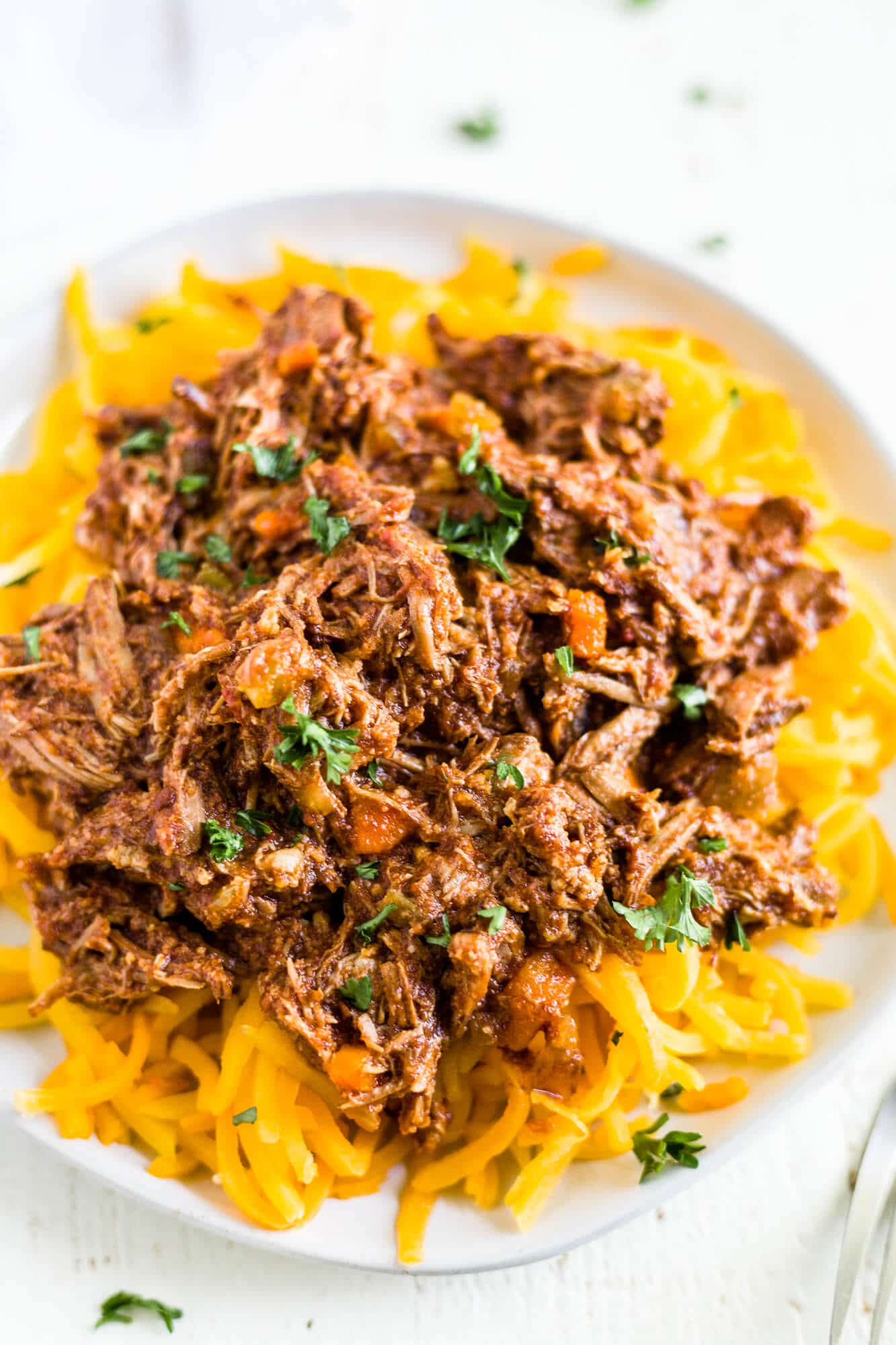 braised beef ragu on top of butternut squash noodles to make it a whole30 recipe