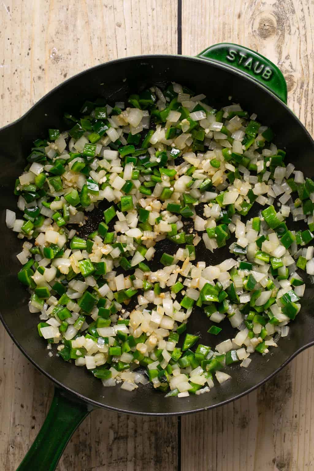 sauteed peppers, onions, and garlic in a skillet.