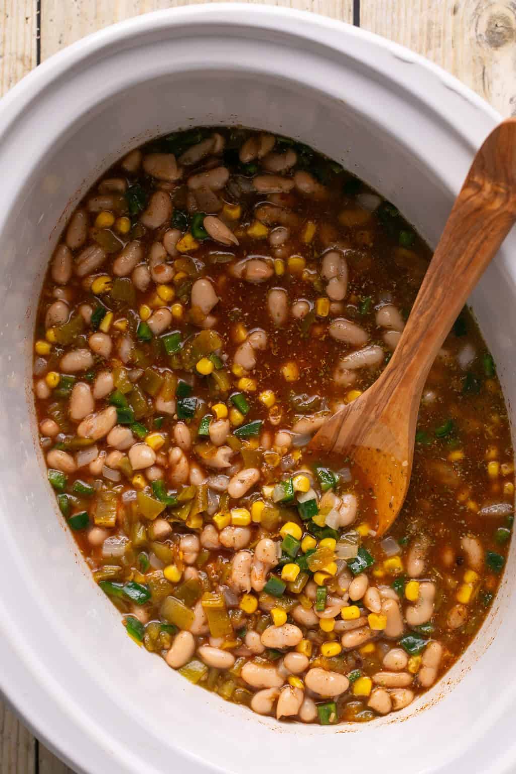 white chicken chili ingredients in a slow cooker.