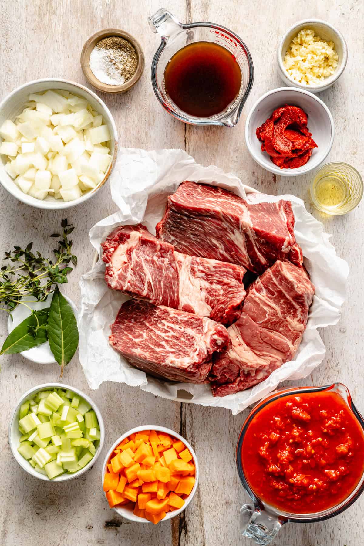 slow cooker beef ragu ingredients on a counter.