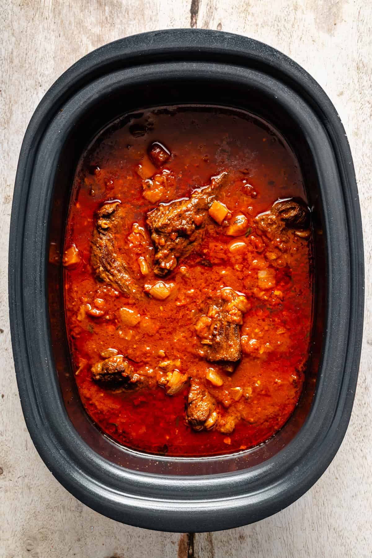 beef ragu in the crock pot after slow cooking for 10 hours.