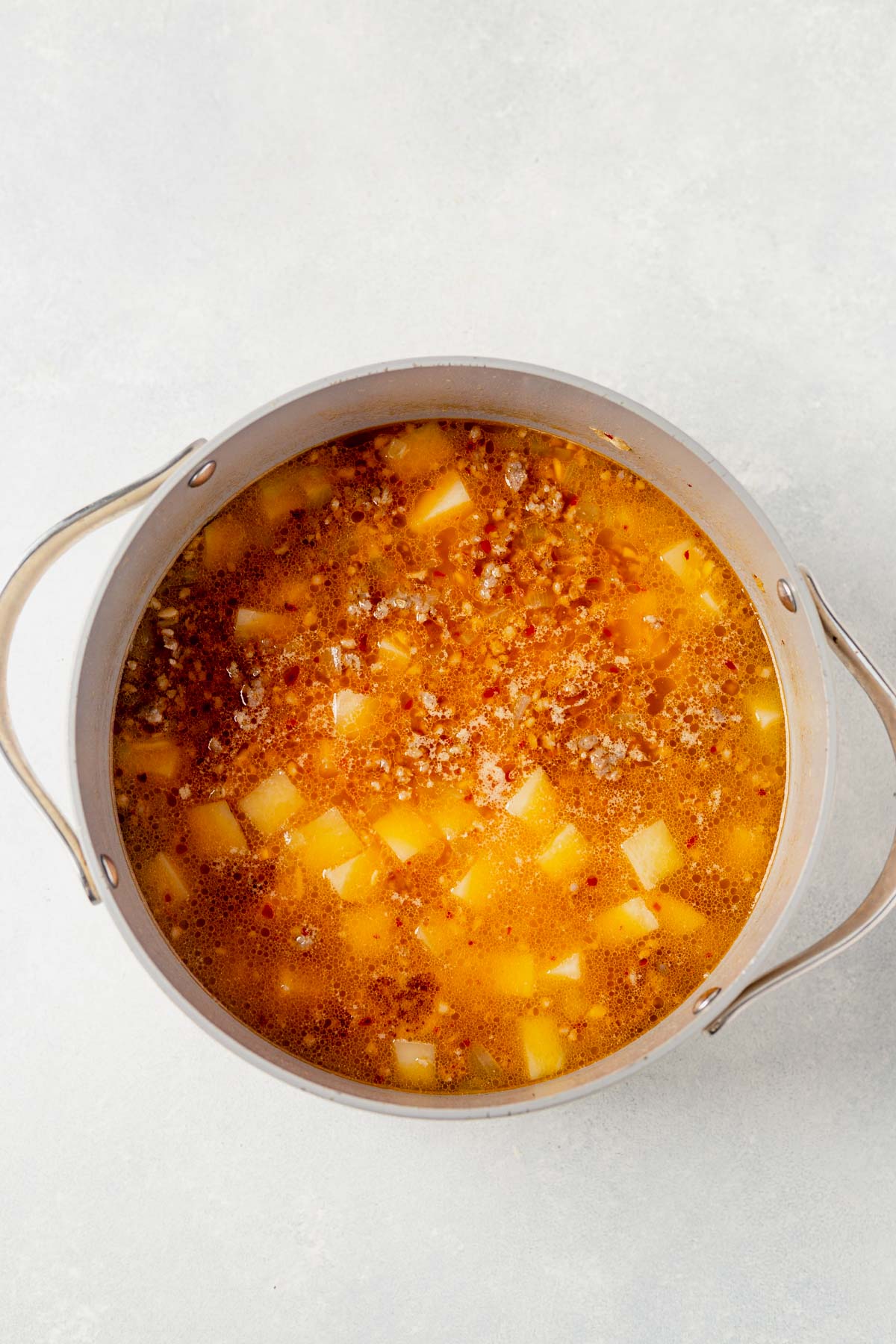 potatoes boiling in whole30 zuppa toscana broth