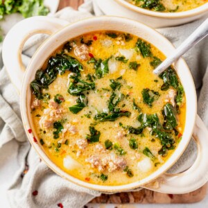 whole30 zuppa toscana in a cream bowl with a serving spoon