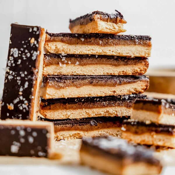 a stack of healthy twix bars on a piece of parchment paper.