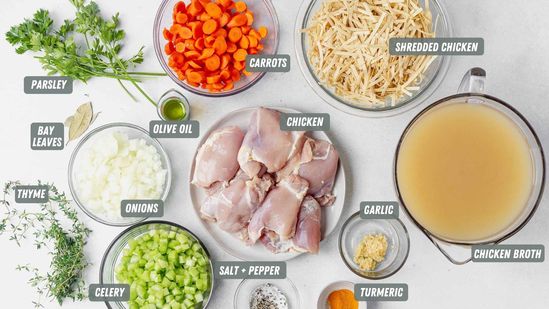 instant pot chicken noodle soup ingredients spread out on a table