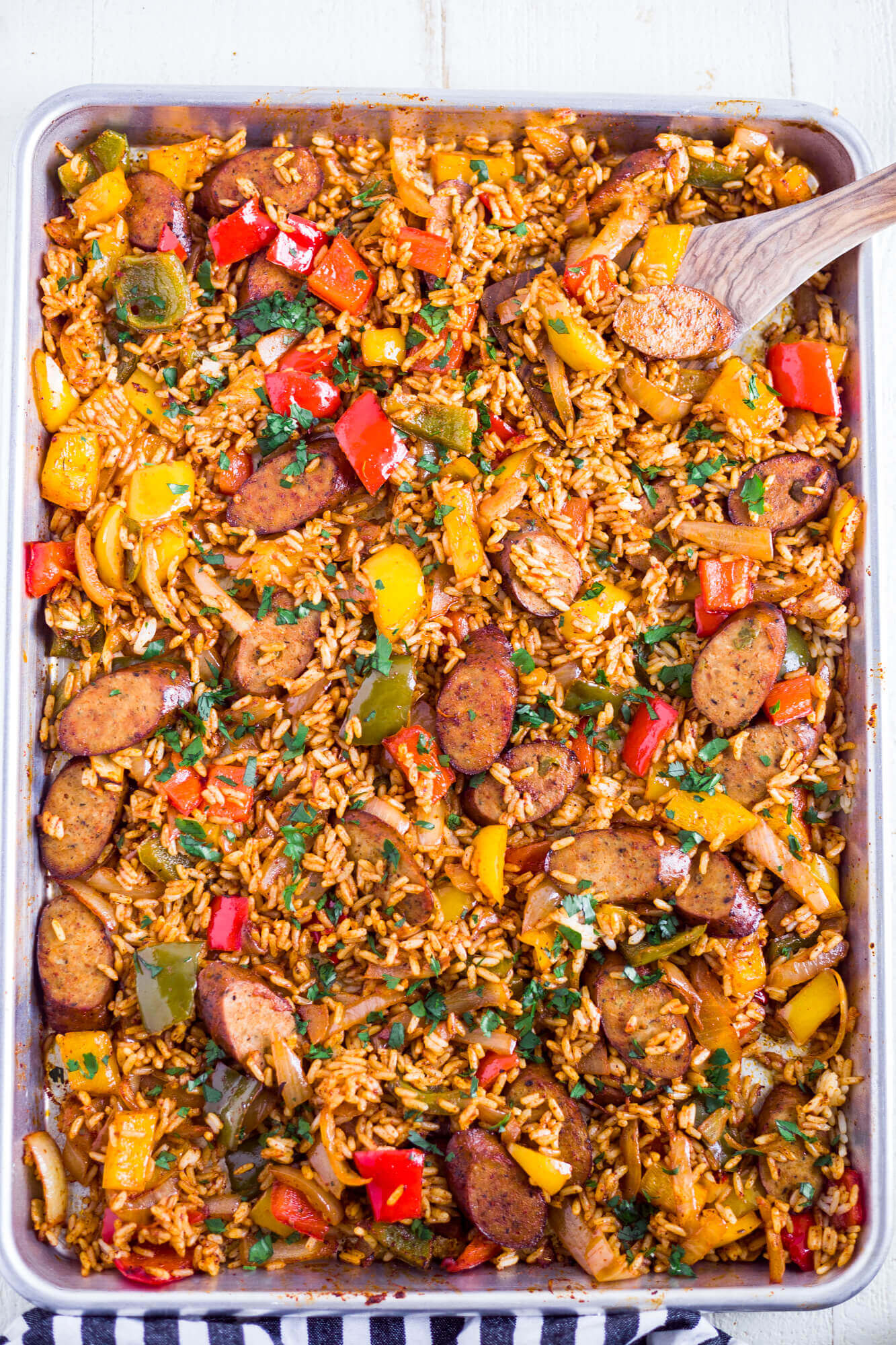 rice, veggies and chicken on a sheet pan for a sheet pan burrito bowl recipe