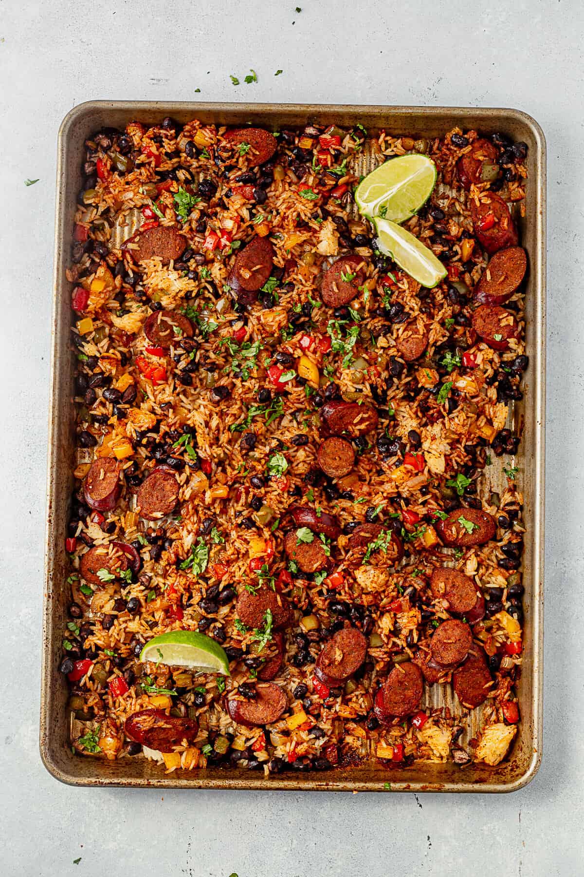 mexican chicken, rice, and veggies on a sheet pan