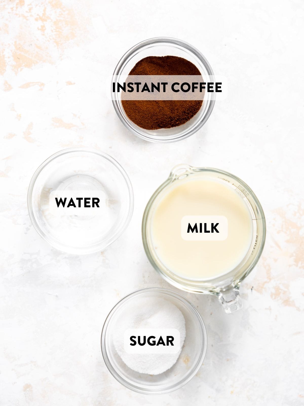 ingredients for whipped coffee recipe on a countertop.