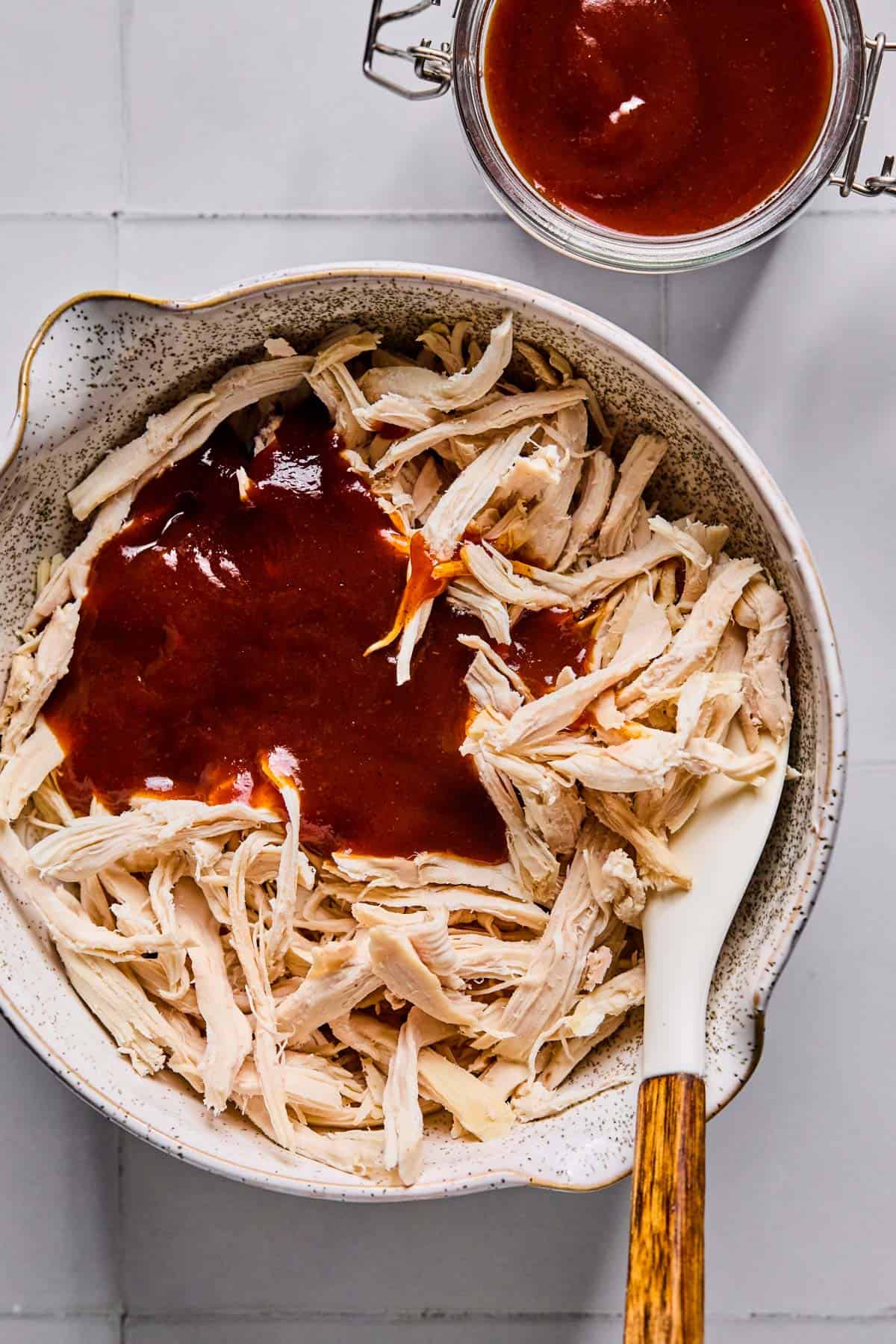 rotisserie chicken for BBQ chicken salad in a bowl with BBQ sauce
