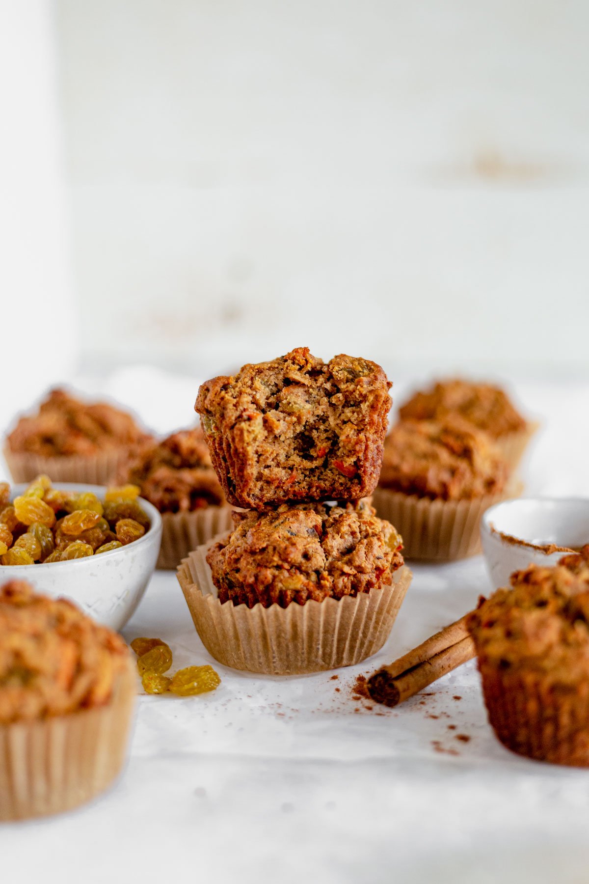 two gluten free morning glory muffins stacked on top of each other