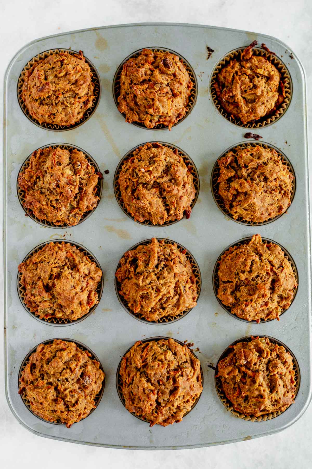 gluten free morning glory muffins cooling in the muffin tin