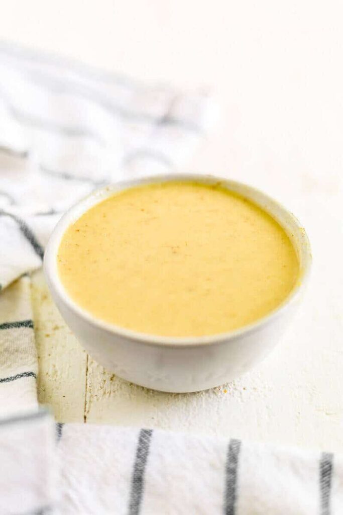 easy paleo honey mustard dressing in a white bowl