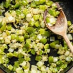 sauteed onion and bell pepper in a skillet.