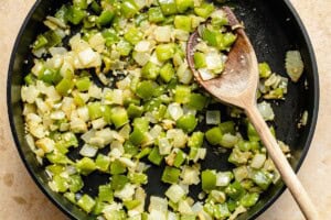 sauteed onion and bell pepper in a skillet.