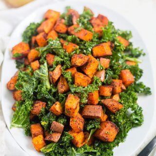 roasted chipotle sweet potato salad on a white plate