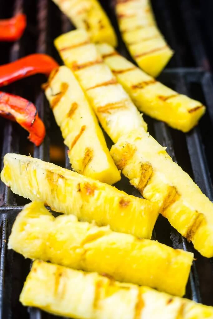 pineapples spears on the grates with grill marks