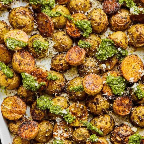 crispy roasted pesto potatoes on a baking sheet.