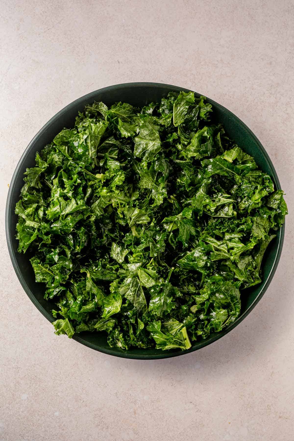 massaged kale in a serving bowl.