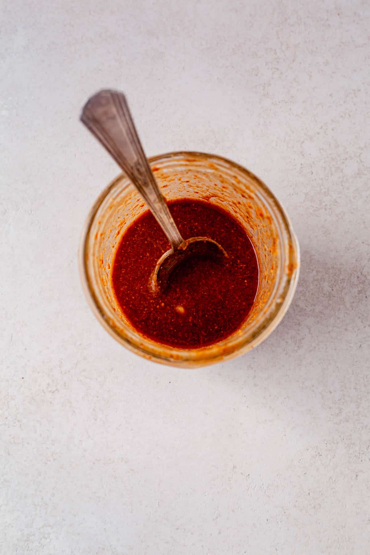 creamy cashew butter dressing in a bowl with a spoon.