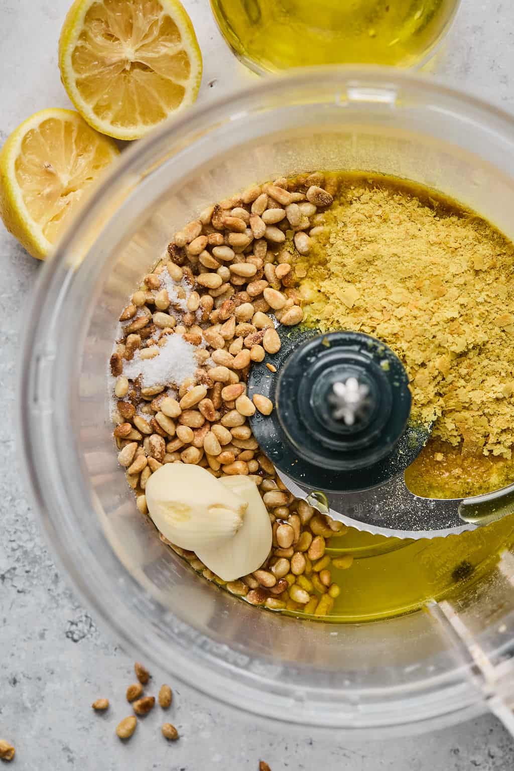 pine nuts, garlic, salt, and nutritional yeast in a food processor.