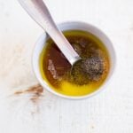 honey, olive oil, salt, pepper and garlic powder in a small bowl