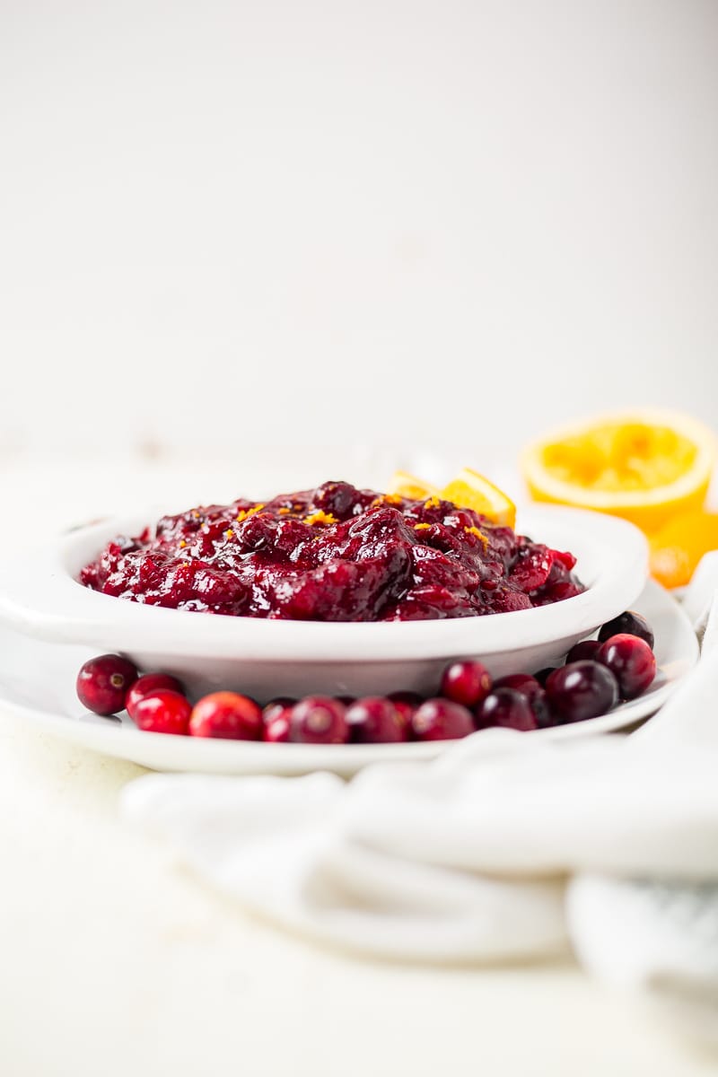 simple cranberry sauce recipe in a white bowl ready to be served at thanksgiving