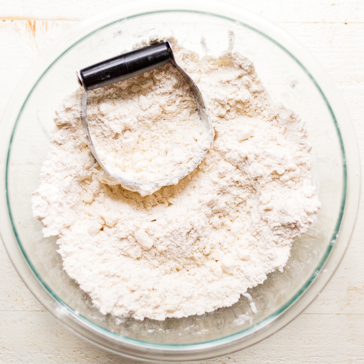 pastry blender mixing gluten free flour and butter for gluten free apple pie