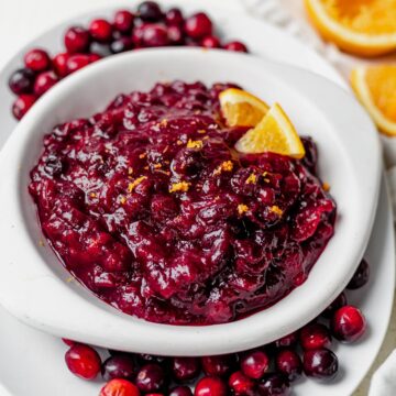 a bowl of healthy cranberry sauce in a white serving dish