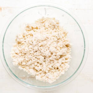 pea sized bits of butter and flour for pie crust in a bowl