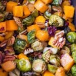 crispy butternut squash and brussel sprouts with cranberries and pecans