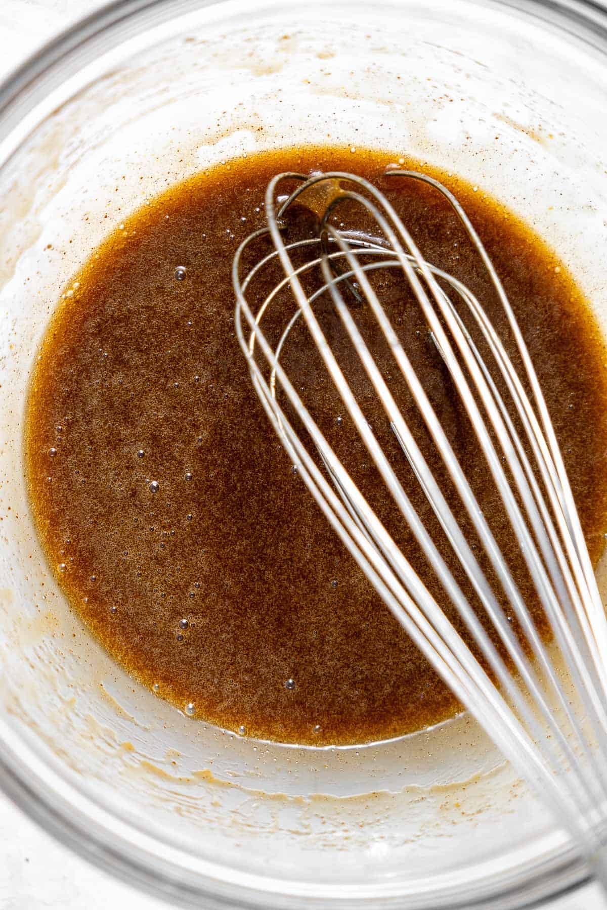 brown butter and sugar whisked in a bowl.