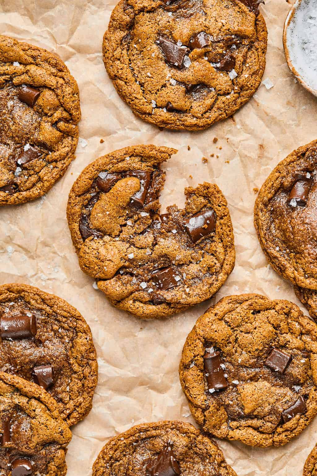 a batch of almond butter cookies on parchment paper.