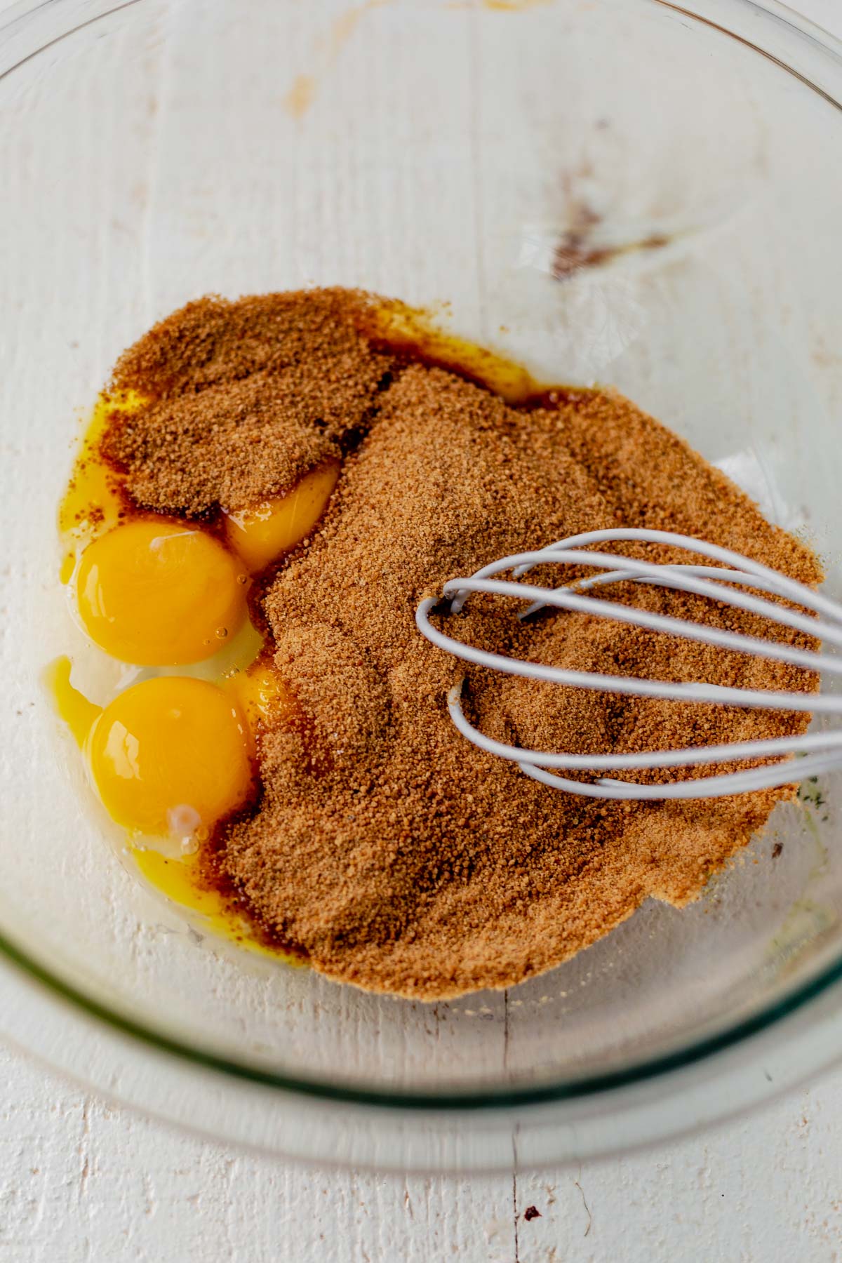egg and sugar whisking in a glass bowl