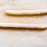 cauliflower gnocchi dough rolled into two long pieces before being cut