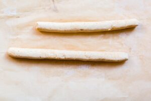 cauliflower gnocchi dough rolled into two long pieces before being cut