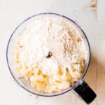 cauliflower and cassava flour in the bowl of a food processor