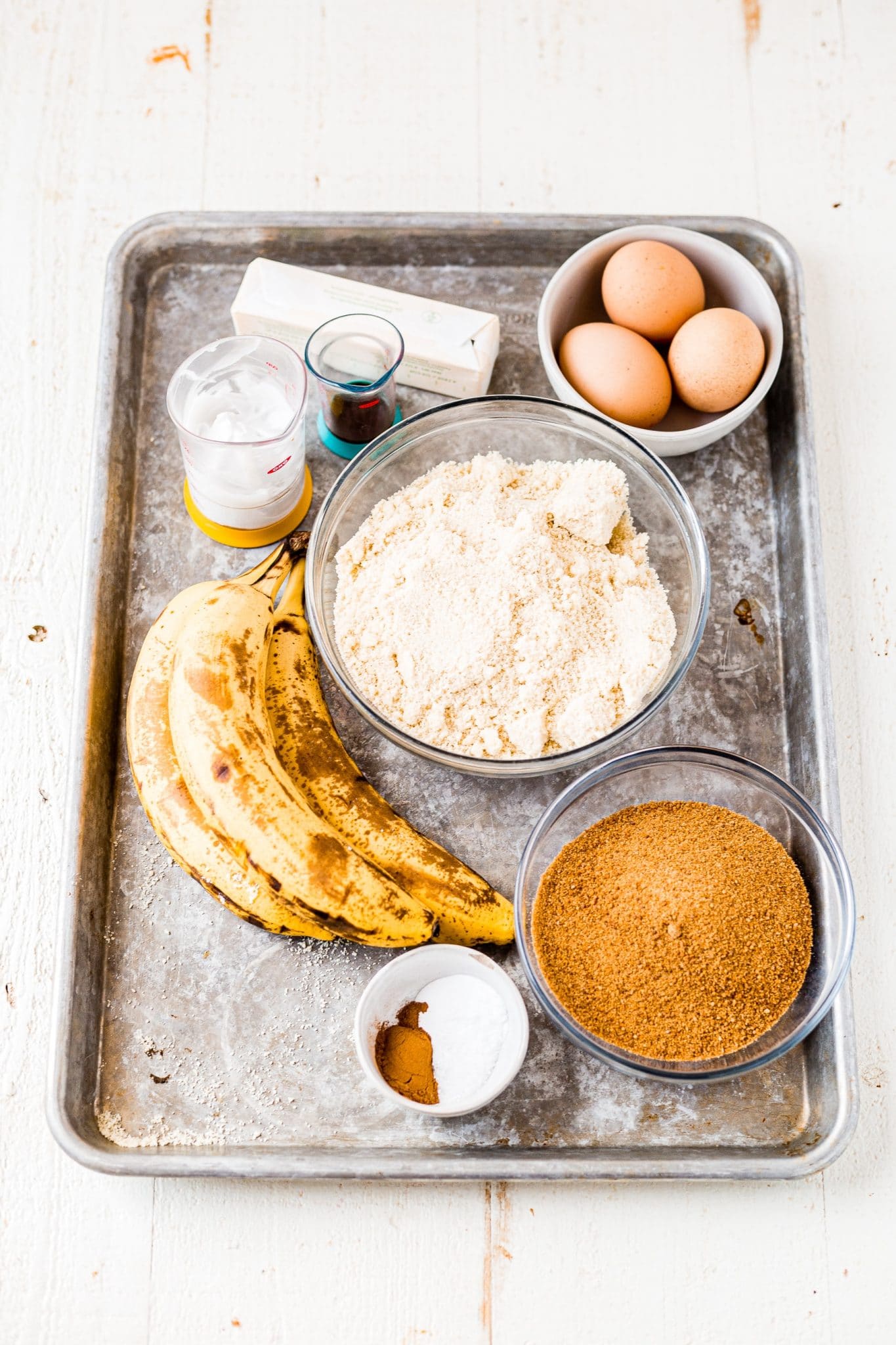 ingredients for gluten free banana bread on a baking sheet