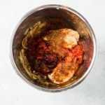 chicken tinga ingredients in the instant pot before being cooked