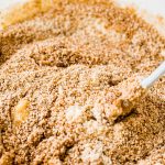 rubber spatula mixing the wet and dry ingredients for almond flour banana bread