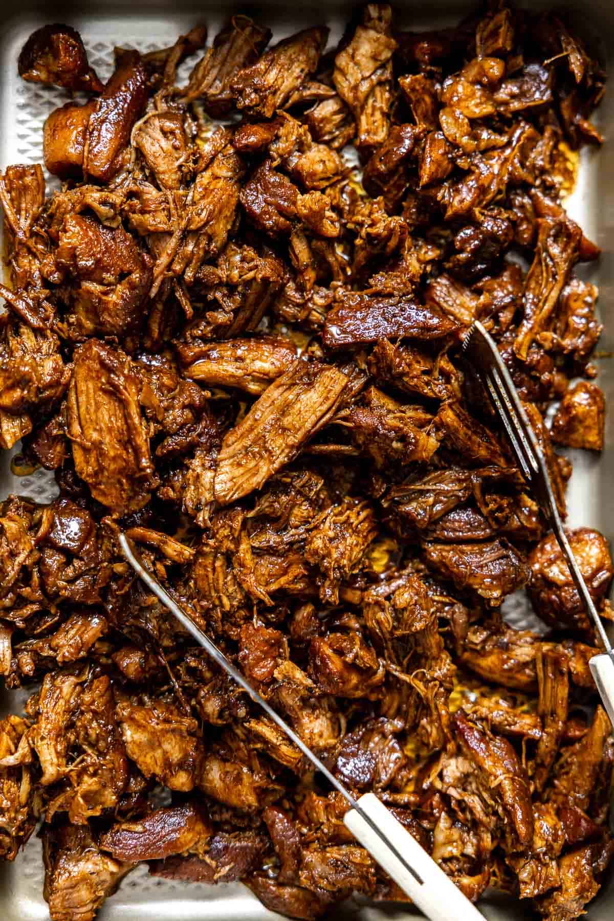 shredded instant pot pulled pork on a sheet pan.