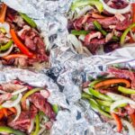 philly cheesesteak foil packs divided into 4 before grilling